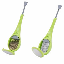 Load image into Gallery viewer, Two lime green manual coffee grinders shown side-by-side on a plain white background, one filled with loose leaf tea and the other with a tea bag.